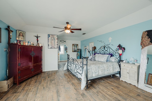 3708 N Moss Ave, Odessa, TX 79764 - bedroom featuring wood finished floors, baseboards, ceiling fan, and arched walkways