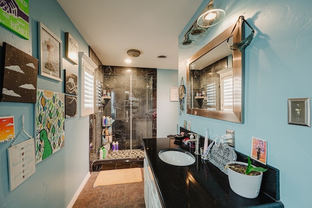 3708 N Moss Ave, Odessa, TX 79764 - bathroom with a stall shower, vanity, and baseboards