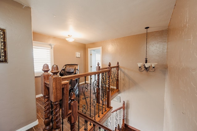 3708 N Moss Ave, Odessa, TX 79764 - stairs featuring a chandelier, baseboards, and a textured wall