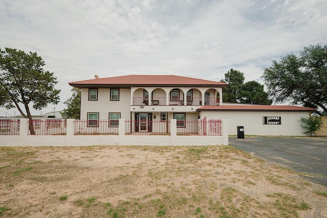 3708 N Moss Ave, Odessa, TX 79764 - rear view of property with stucco siding and a tiled roof