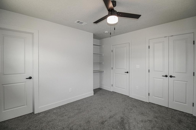 607 NW 11th St, Andrews, TX 79714 - unfurnished bedroom with carpet, a textured ceiling, and ceiling fan