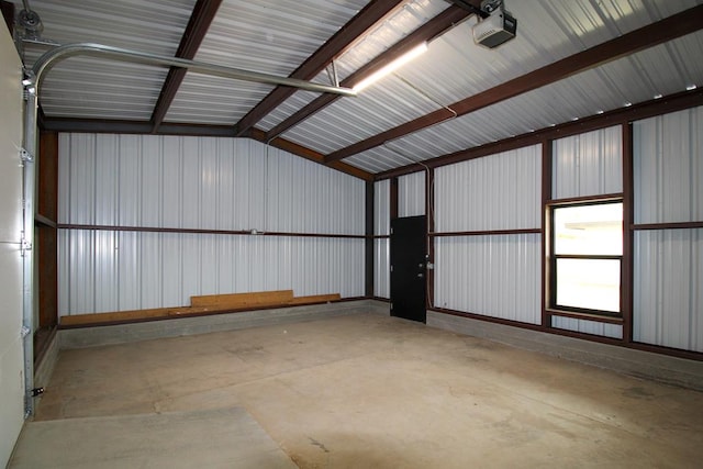 607 NW 11th St, Andrews, TX 79714 - garage featuring a garage door opener
