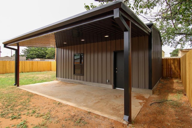 607 NW 11th St, Andrews, TX 79714 - fenced backyard featuring a patio area