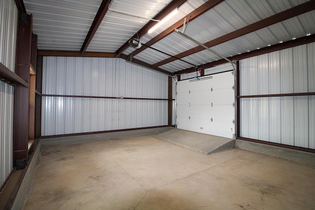 607 NW 11th St, Andrews, TX 79714 - garage featuring a garage door opener