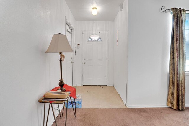 1206 Alameda Ave, Odessa, TX 79763 - foyer featuring light colored carpet and baseboards