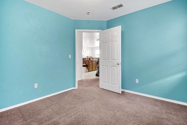 1206 Alameda Ave, Odessa, TX 79763 - empty room featuring carpet floors and baseboards