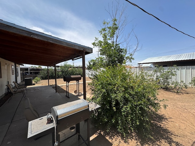 1044 Washington St, Kermit, TX 79745 - fenced backyard with a patio area and central AC