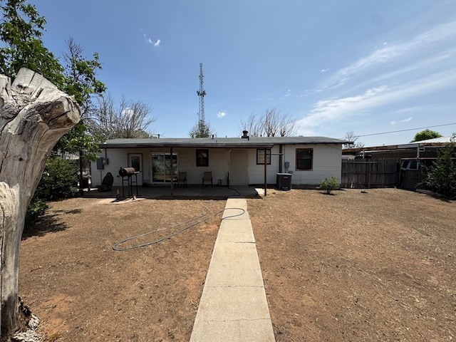 1044 Washington St, Kermit, TX 79745 - back of house with a patio area and central air condition unit