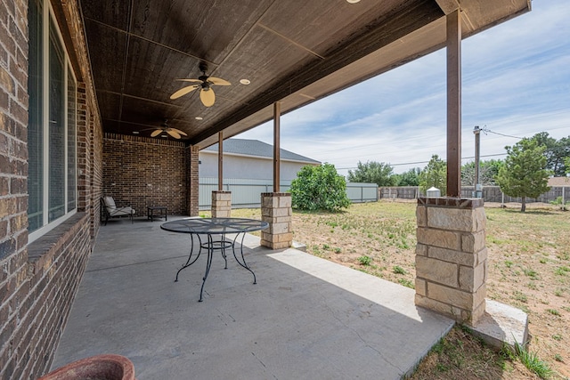 14105 County Rd 122, Odessa, TX 79765 - view of patio / terrace featuring ceiling fan, a fenced backyard, and outdoor dining space