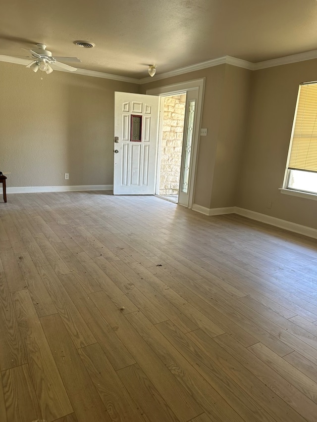 302 E Byrd St, Universal City, TX 78148 - empty room with hardwood / wood-style floors, crown molding, baseboards, and a ceiling fan