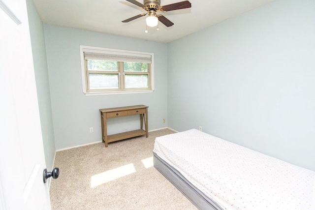 bedroom featuring baseboards, carpet flooring, and a ceiling fan