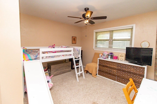 carpeted bedroom with a ceiling fan