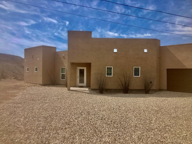420 Santana Dr, Lajitas, TX 79852 - rear view of house with stucco siding