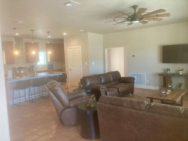 420 Santana Dr, Lajitas, TX 79852 - living room with ceiling fan, recessed lighting, light tile patterned floors, and baseboards