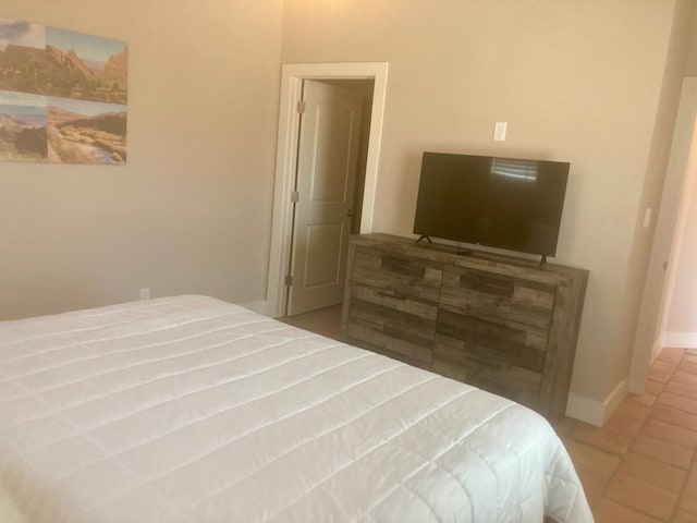420 Santana Dr, Lajitas, TX 79852 - bedroom with tile patterned flooring and baseboards
