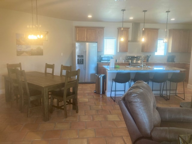 420 Santana Dr, Lajitas, TX 79852 - kitchen with stainless steel appliances, wall chimney range hood, a sink, healthy amount of natural light, and recessed lighting