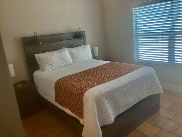 420 Santana Dr, Lajitas, TX 79852 - tiled bedroom featuring baseboards