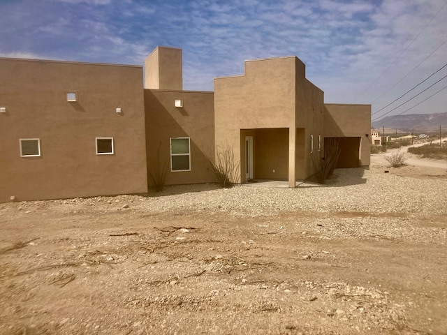 420 Santana Dr, Lajitas, TX 79852 - rear view of property with stucco siding