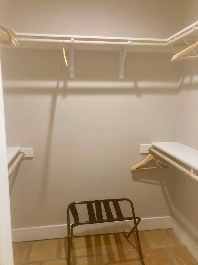 420 Santana Dr, Lajitas, TX 79852 - walk in closet with light tile patterned flooring