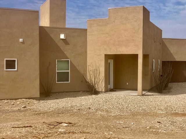 420 Santana Dr, Lajitas, TX 79852 - back of property featuring stucco siding and a patio area