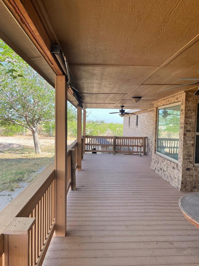 deck featuring ceiling fan and a porch