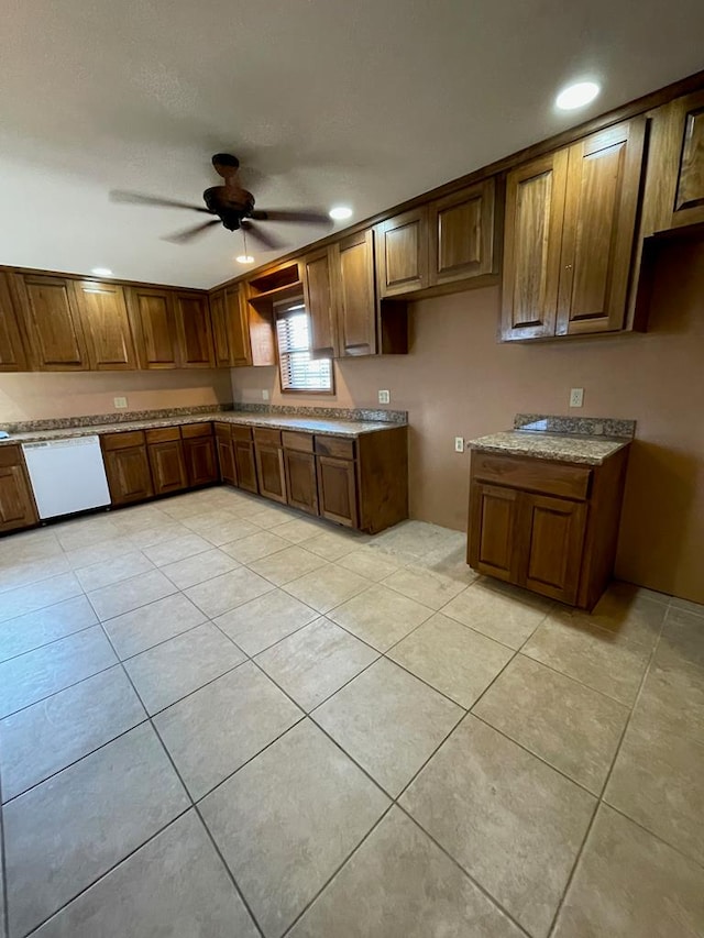 kitchen featuring white dishwasher, ceiling fan, and light tile patterned floors