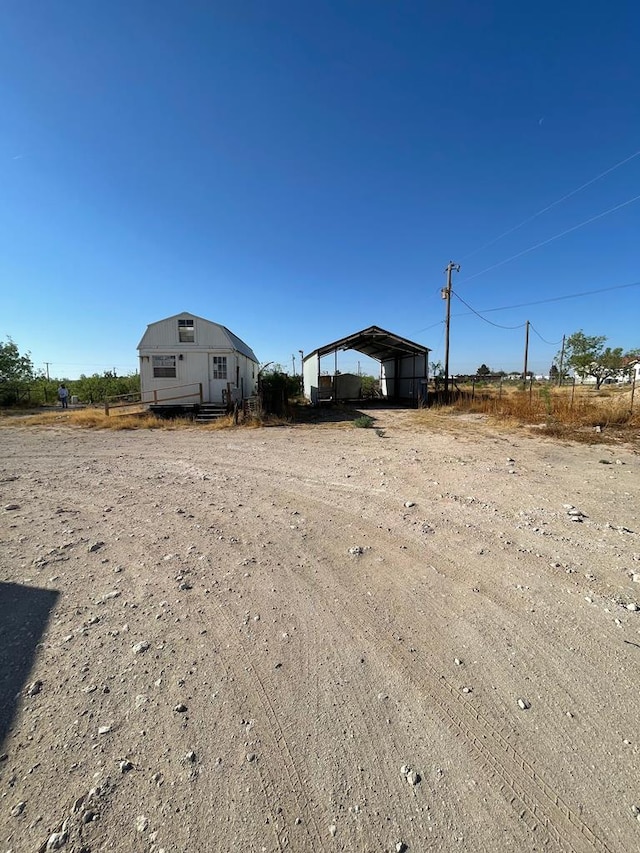 view of yard with a carport