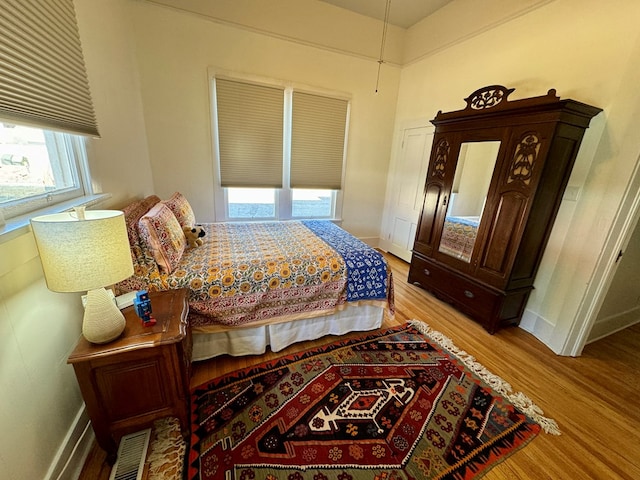 bedroom featuring light wood-type flooring