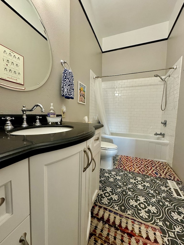 full bathroom featuring tile patterned floors, vanity, toilet, and shower / tub combo with curtain