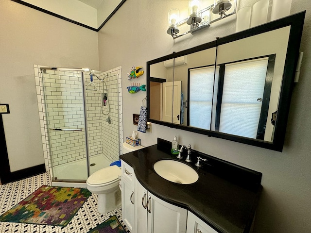 bathroom with tile patterned floors, vanity, toilet, and a shower with door