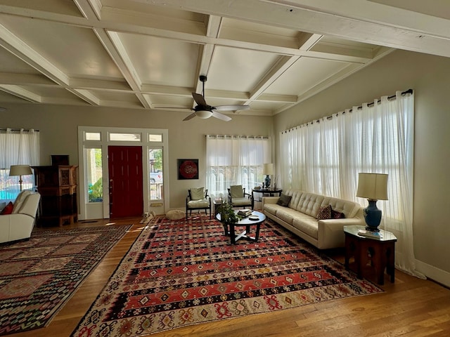 living room featuring beam ceiling, ceiling fan, coffered ceiling, and hardwood / wood-style flooring