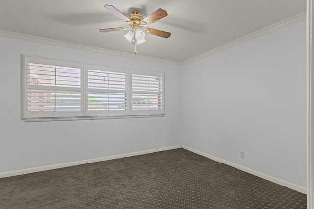empty room with dark colored carpet, ornamental molding, baseboards, and ceiling fan