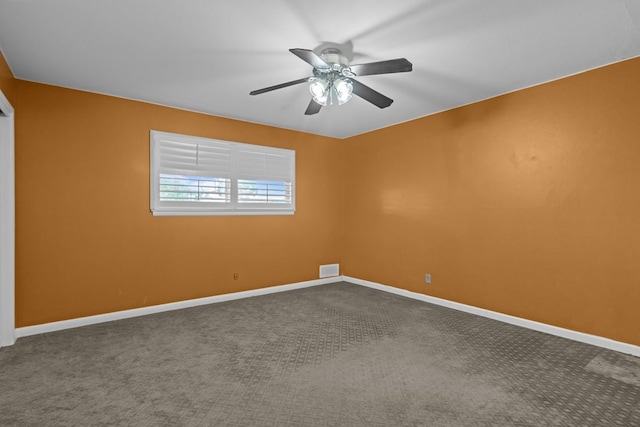 empty room featuring baseboards, a ceiling fan, carpet flooring, and visible vents