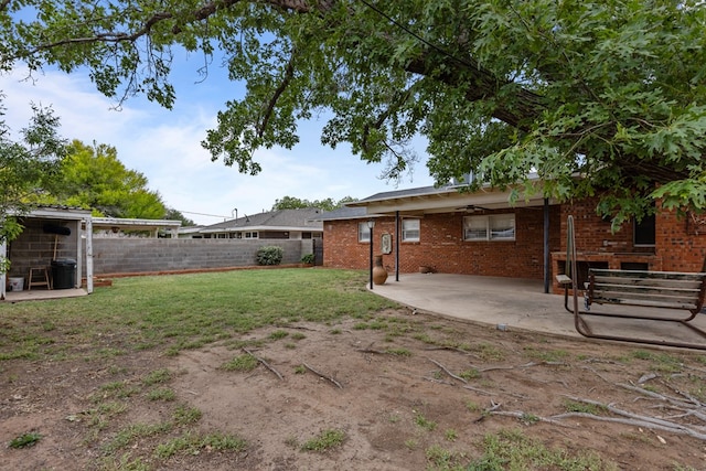view of yard with fence and a patio area