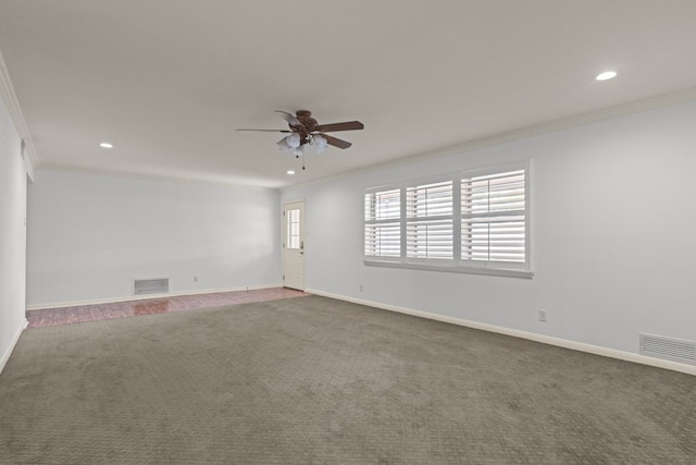 carpeted spare room with ornamental molding, recessed lighting, ceiling fan, and visible vents