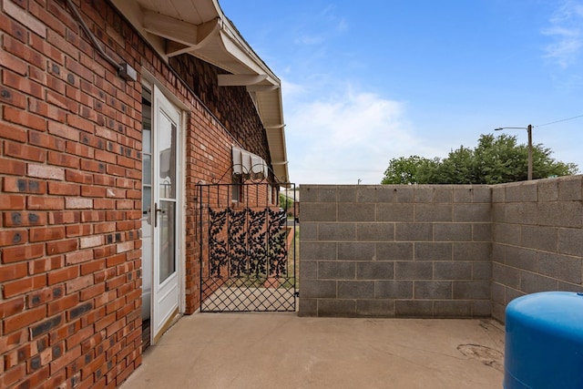 view of patio / terrace with a gate