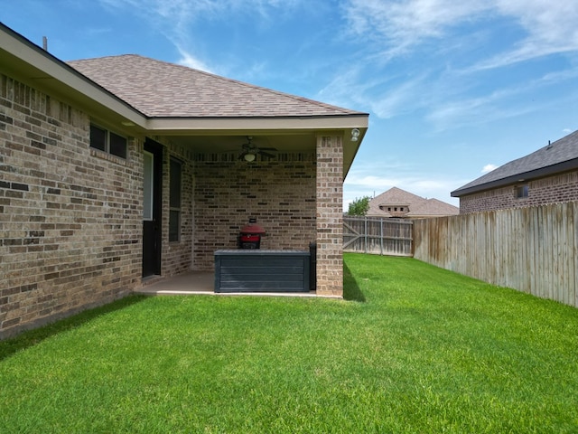 32 Balmoral Cir, Odessa, TX 79765 - fenced backyard with a ceiling fan and a patio area