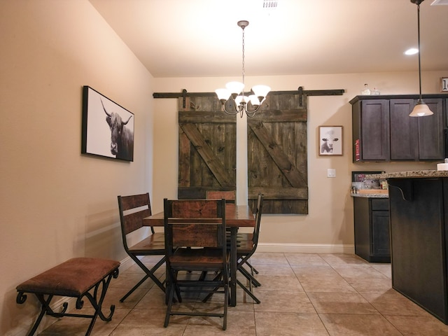 32 Balmoral Cir, Odessa, TX 79765 - dining space featuring a barn door and light tile patterned floors