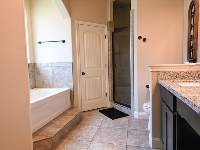 32 Balmoral Cir, Odessa, TX 79765 - full bath featuring vanity, a shower stall, a bath, and tile patterned flooring