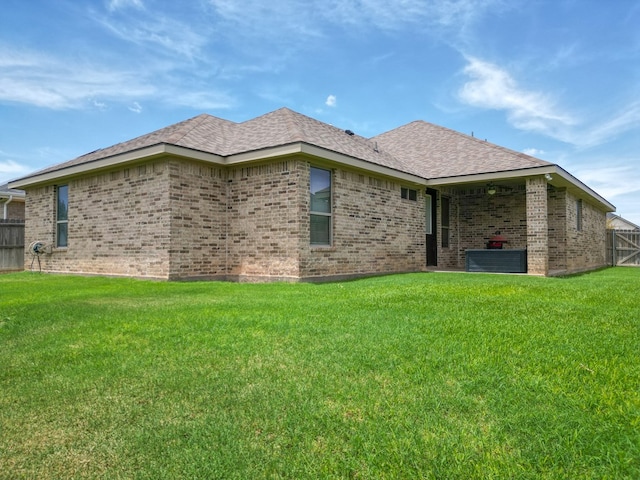 32 Balmoral Cir, Odessa, TX 79765 - back of property featuring brick siding and a shingled roof