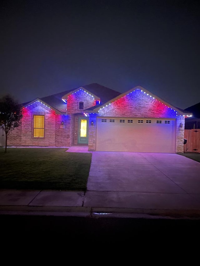 32 Balmoral Cir, Odessa, TX 79765 - view of front of property with stone siding, concrete driveway, and an attached garage
