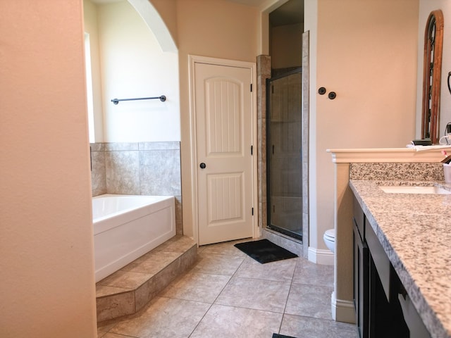 32 Balmoral Cir, Odessa, TX 79765 - bathroom with vanity, a shower stall, a bath, and tile patterned floors