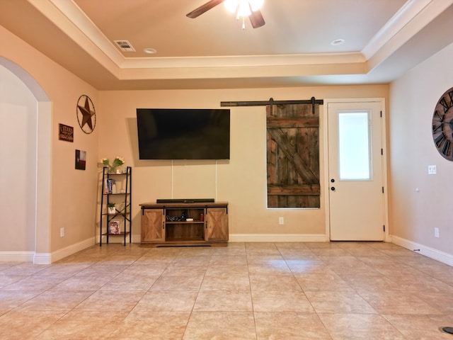32 Balmoral Cir, Odessa, TX 79765 - unfurnished living room featuring a raised ceiling, arched walkways, ceiling fan, crown molding, and tile patterned flooring