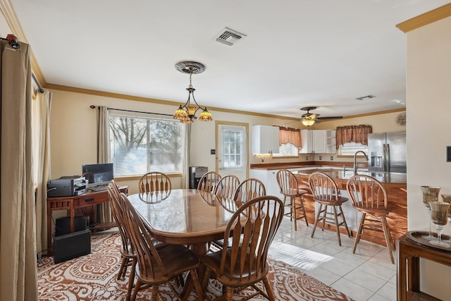 203 NE 8th St, Marathon, TX 79842 - dining room with ornamental molding, light tile patterned flooring, and a ceiling fan