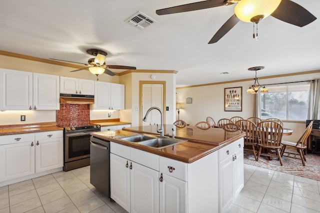 203 NE 8th St, Marathon, TX 79842 - kitchen featuring stainless steel appliances, under cabinet range hood, ceiling fan, a sink, and light tile patterned floors