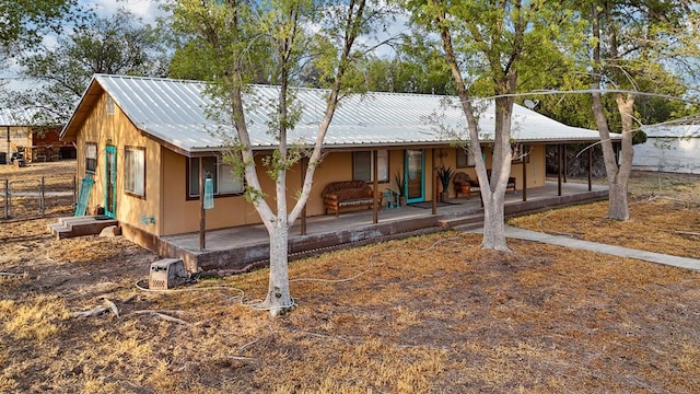 203 NE 8th St, Marathon, TX 79842 - view of front of property with covered porch and metal roof