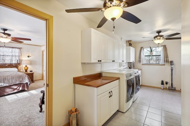 203 NE 8th St, Marathon, TX 79842 - laundry area featuring independent washer and dryer, cabinet space, a ceiling fan, baseboards, and light tile patterned floors
