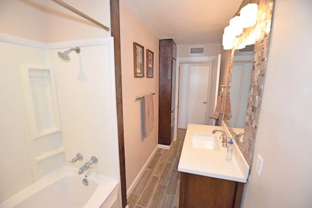 bathroom with vanity and bathing tub / shower combination