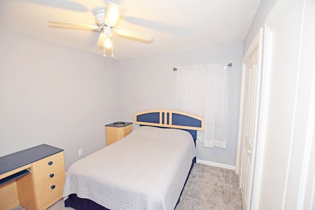 bedroom featuring ceiling fan and light colored carpet