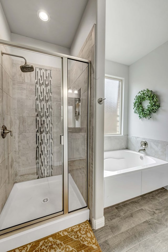 8430 E County Rd 114, Midland, TX 79706 - full bathroom featuring a bath, a stall shower, and recessed lighting